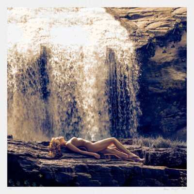 Art photograph of a nude female in nature. Limited edition