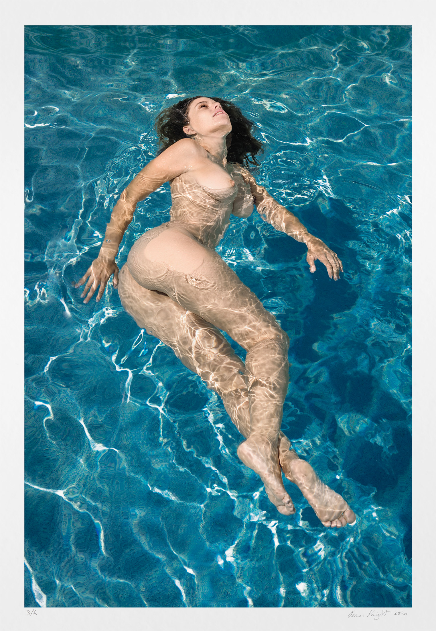 Artistic erotic photography: limited edition swimming nude woman