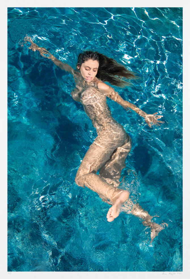 This original art nude photography draws inspiration from pinup and performance. The nude woman swimming is jubilant and defies convention