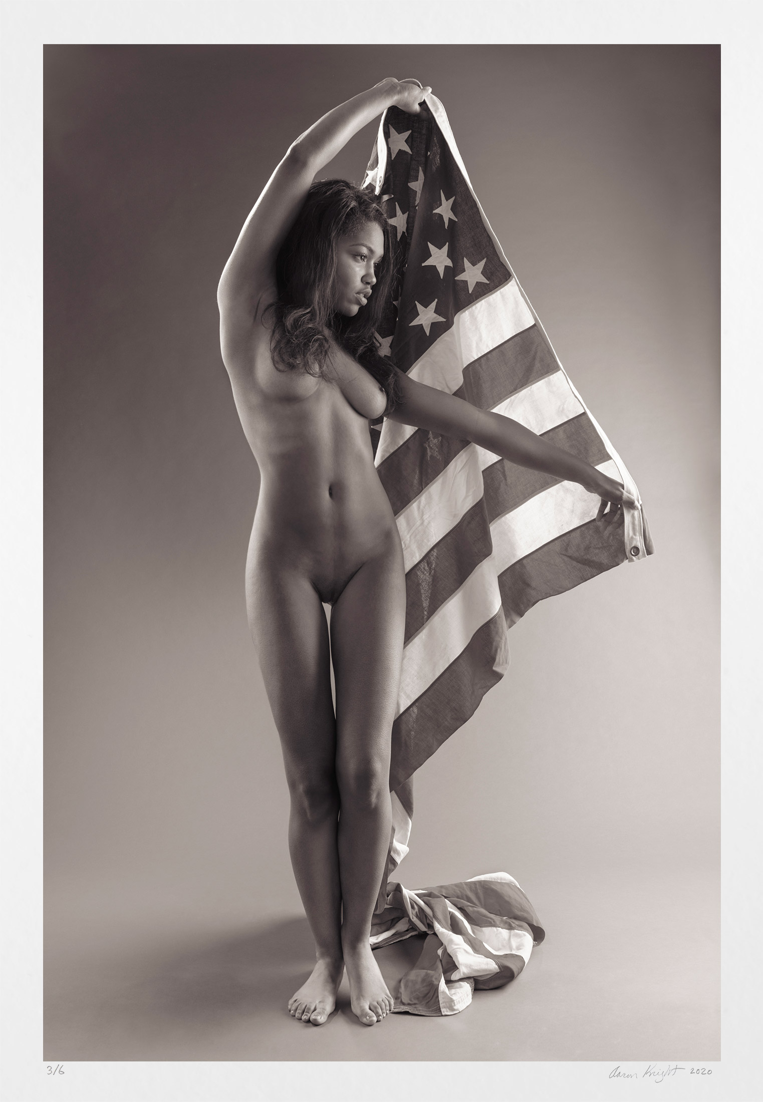 The nude in photography, black and white, paired with flag